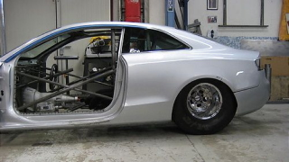 Illustration for article titled Watch an Audi A5 transform into a drag car